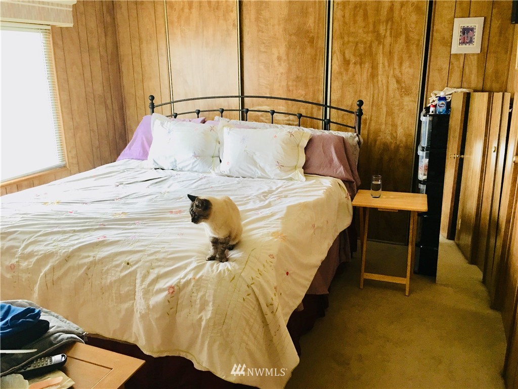 312 Meier Road Winlock, WA 98596 - Photo 10 of 18 a bedroom with a bed and a walk in closet