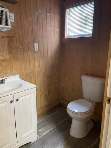 a white toilet sitting next to a bathroom sink