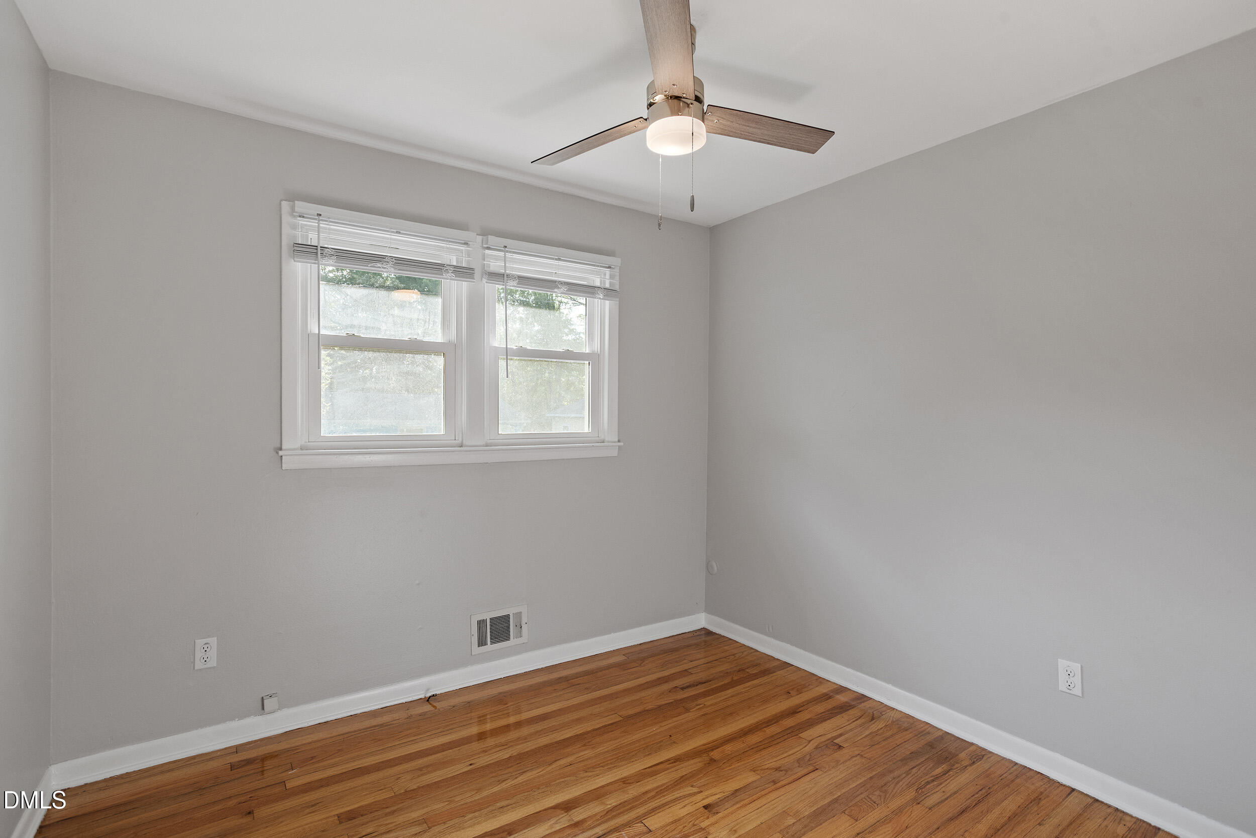 2414 Chapin Street Durham, NC 27707 - Photo 27 of 30 a view of an empty room with wooden floor and a window