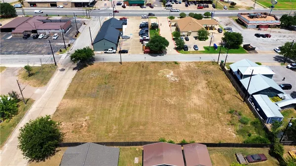 an aerial view of a house with a swimming pool