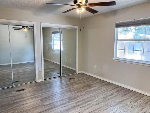 a bathroom with a sink a mirror and a shower