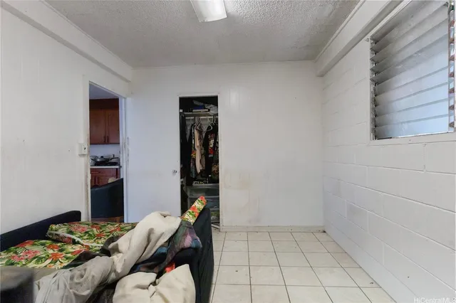 a balcony of a house with wooden floor and outdoor seating