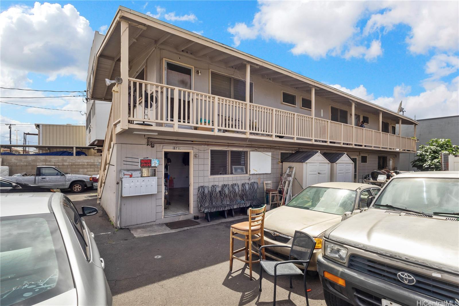 219 Kalihi Street Honolulu, HI 96819 - Photo 2 of 25 a front view of a house with a yard