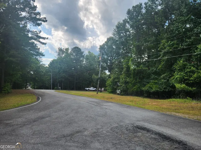 a view of a swimming pool with an outdoor space and seating area