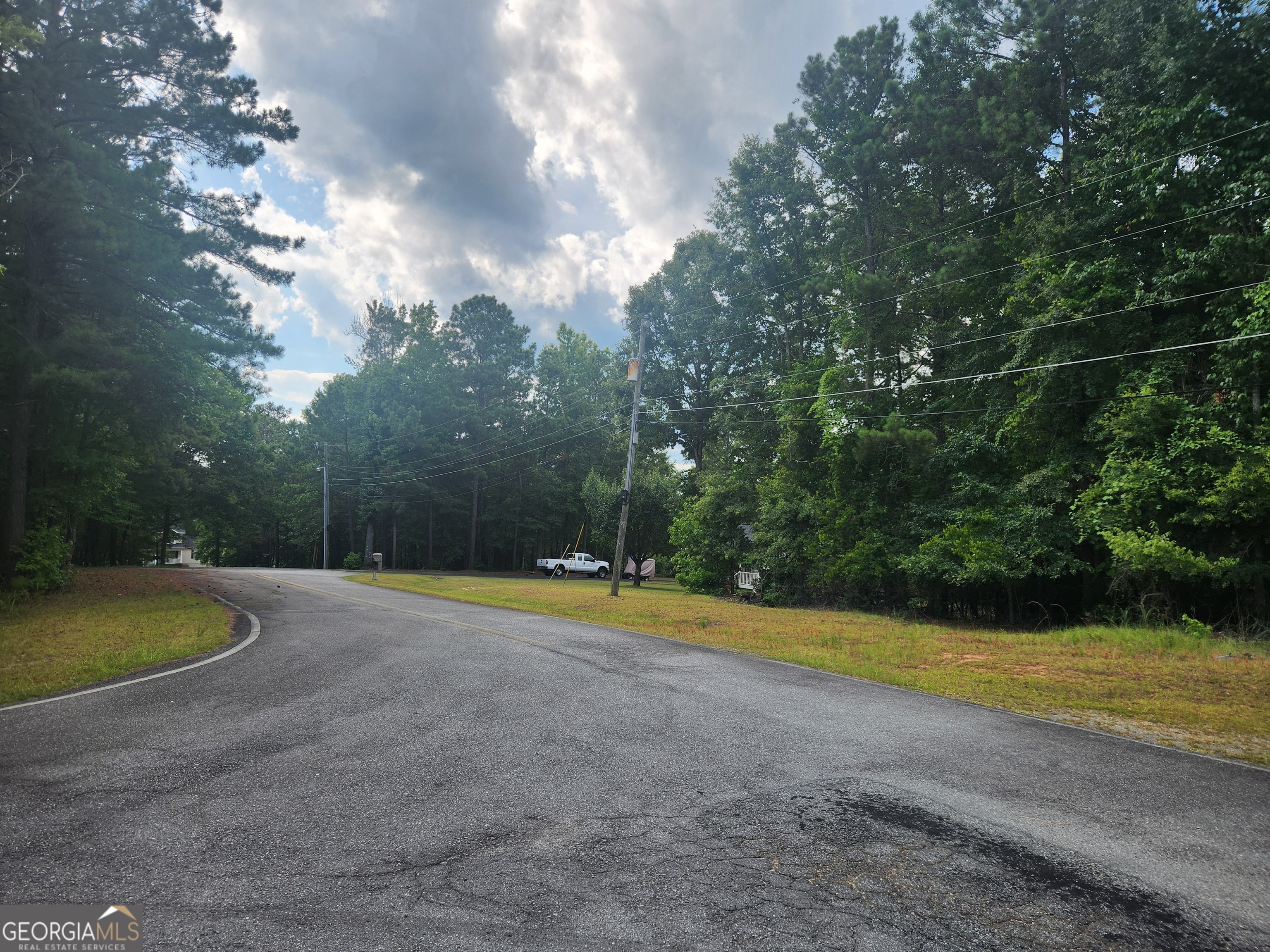 0 Hidden Hills Macon, GA 31217 - Photo 3 of 6 a view of a swimming pool with an outdoor space and seating area