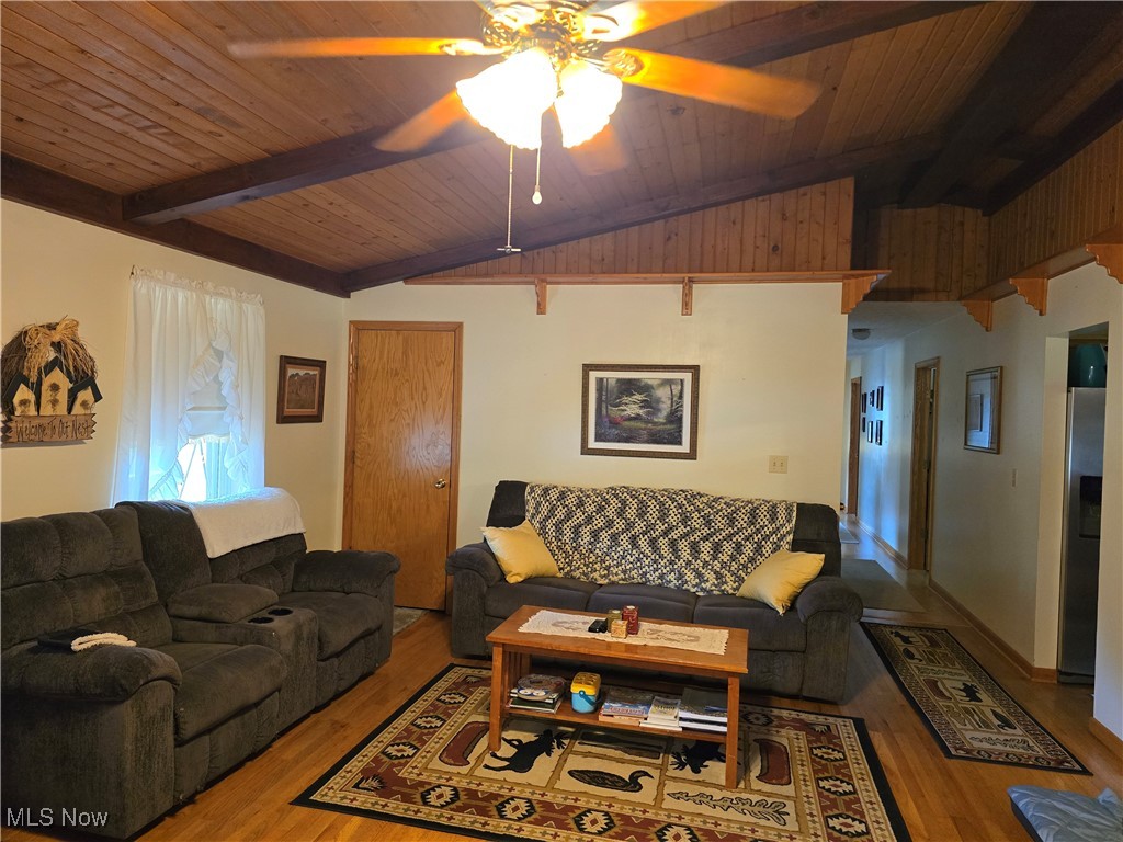 33 Lane Road Vincent, OH 45784 - Photo 11 of 36 Living room featuring ceiling fan, hardwood / wood-style flooring, lofted ceiling with beams, and wood ceiling