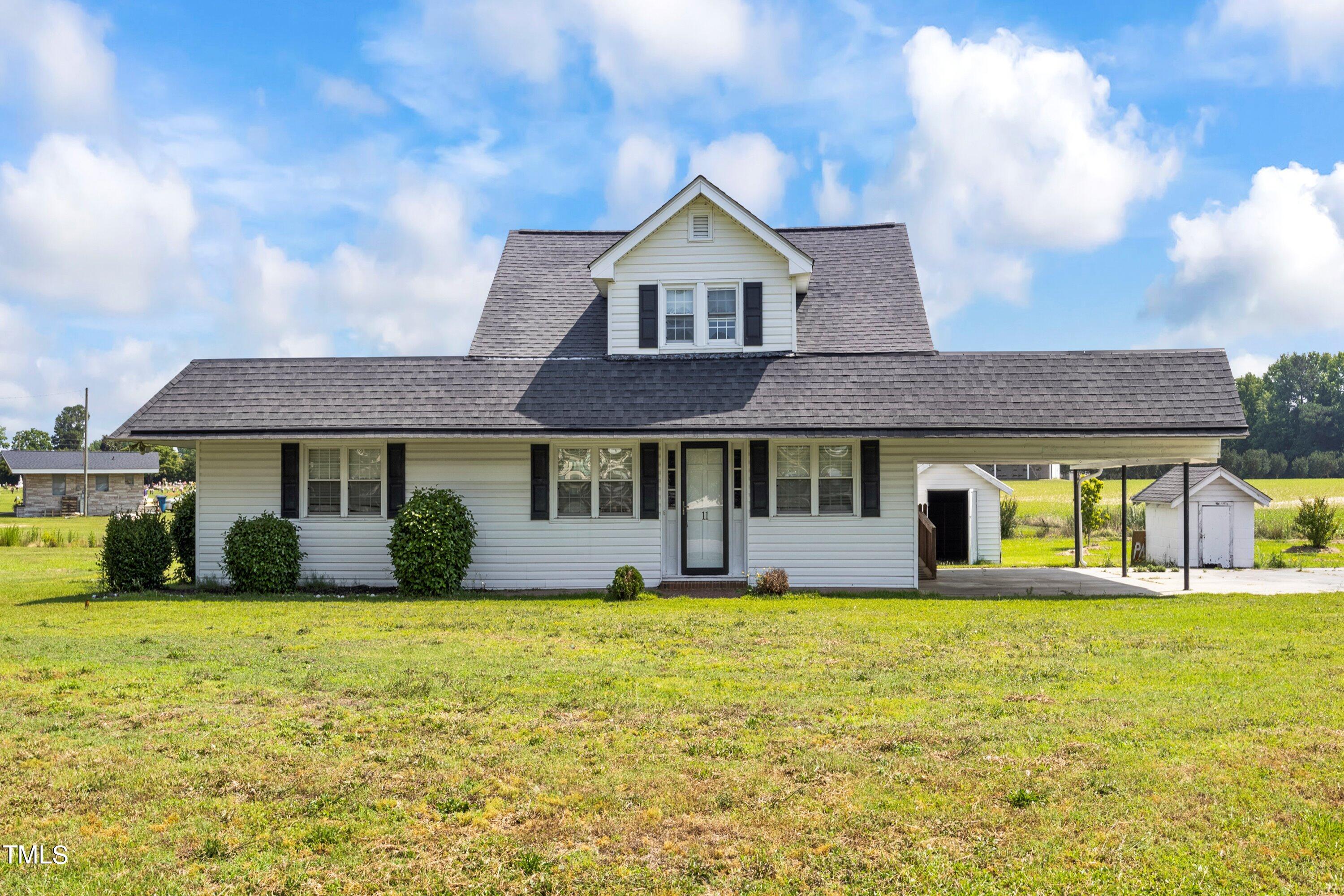 11 Partin Road Dunn, NC 28334 - Photo 1 of 46 a front view of a house with a yard