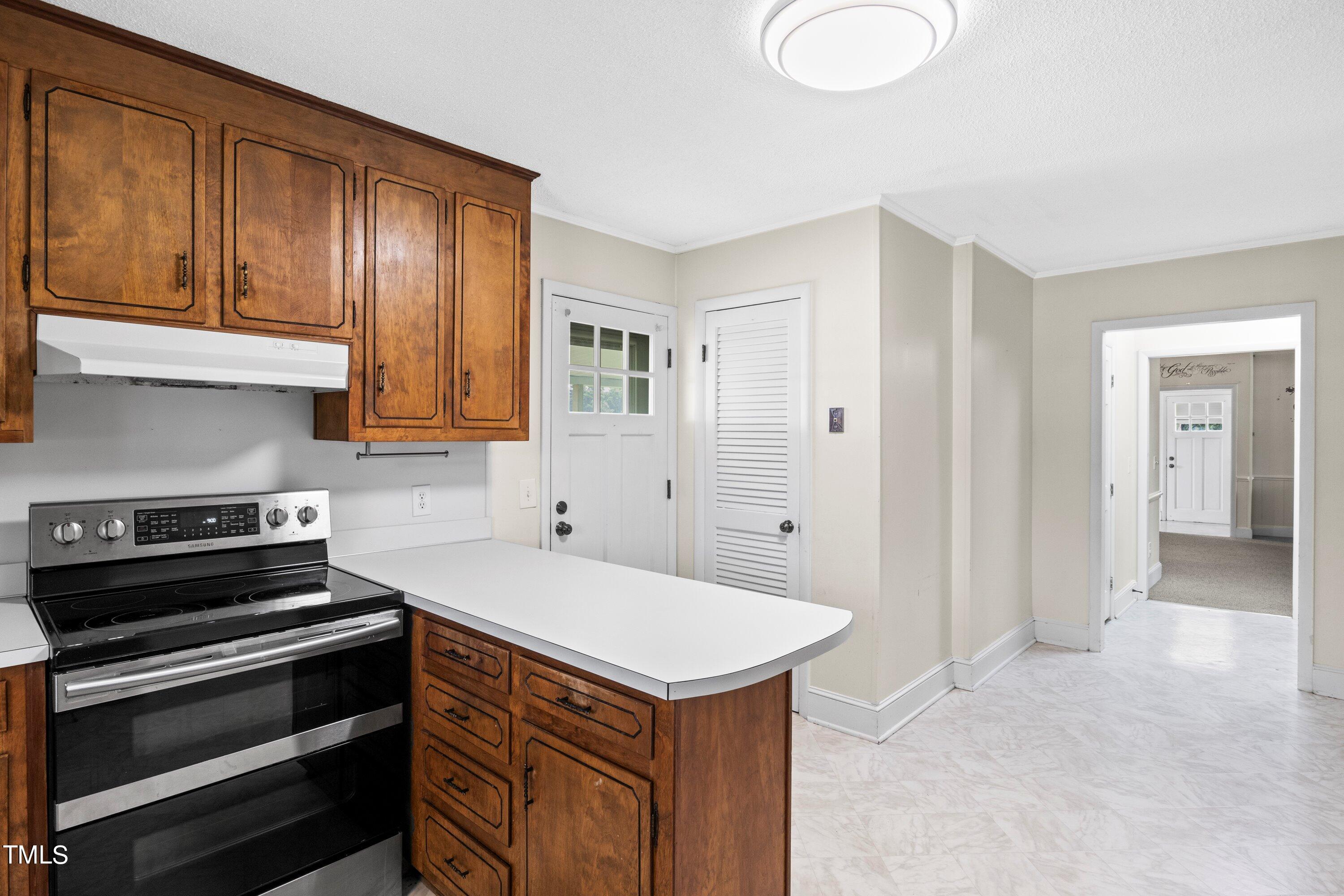 11 Partin Road Dunn, NC 28334 - Photo 15 of 46 a kitchen with a stove and a sink