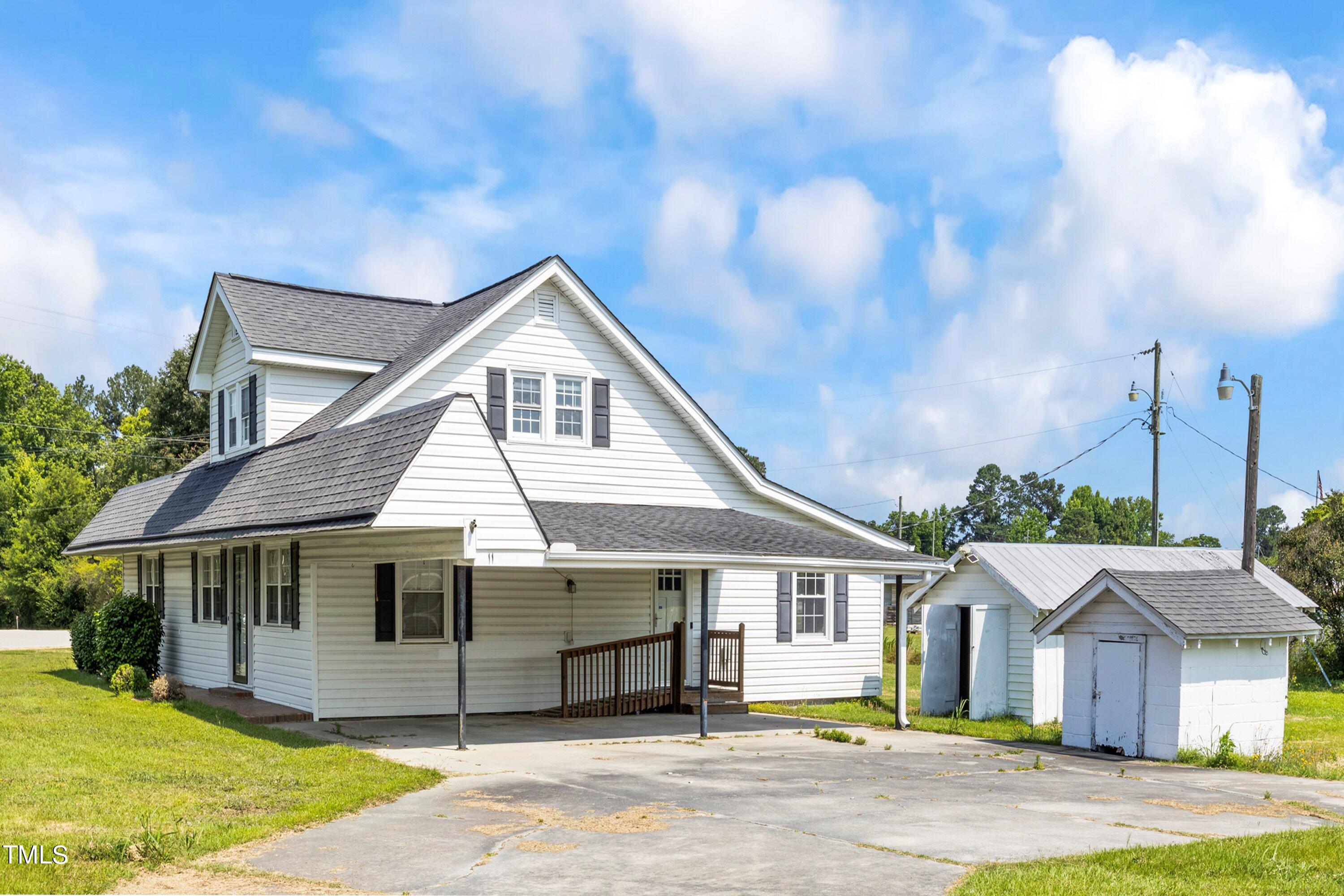 11 Partin Road Dunn, NC 28334 - Photo 4 of 46 a front view of a house with a garden