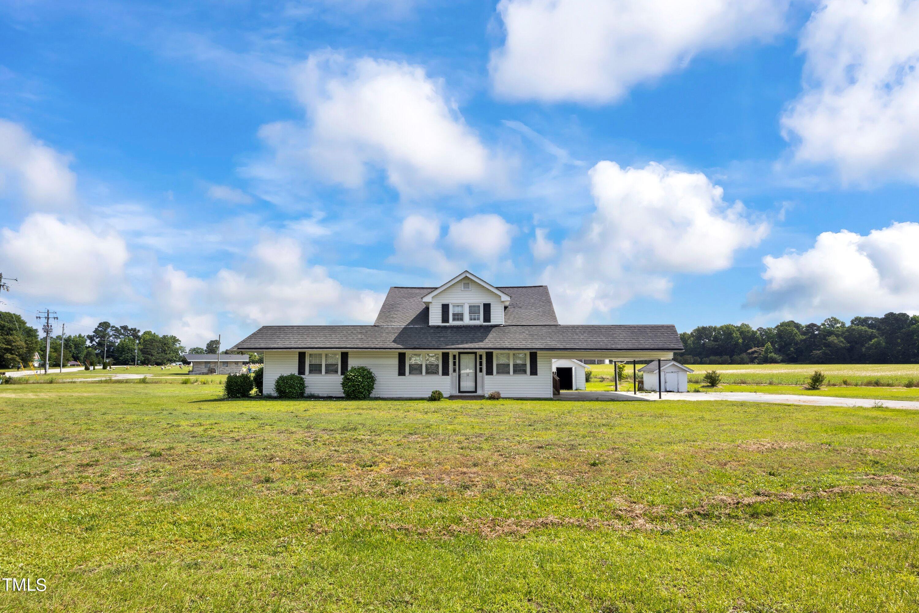 11 Partin Road Dunn, NC 28334 - Photo 43 of 46 a view of an ocean with a building in the background