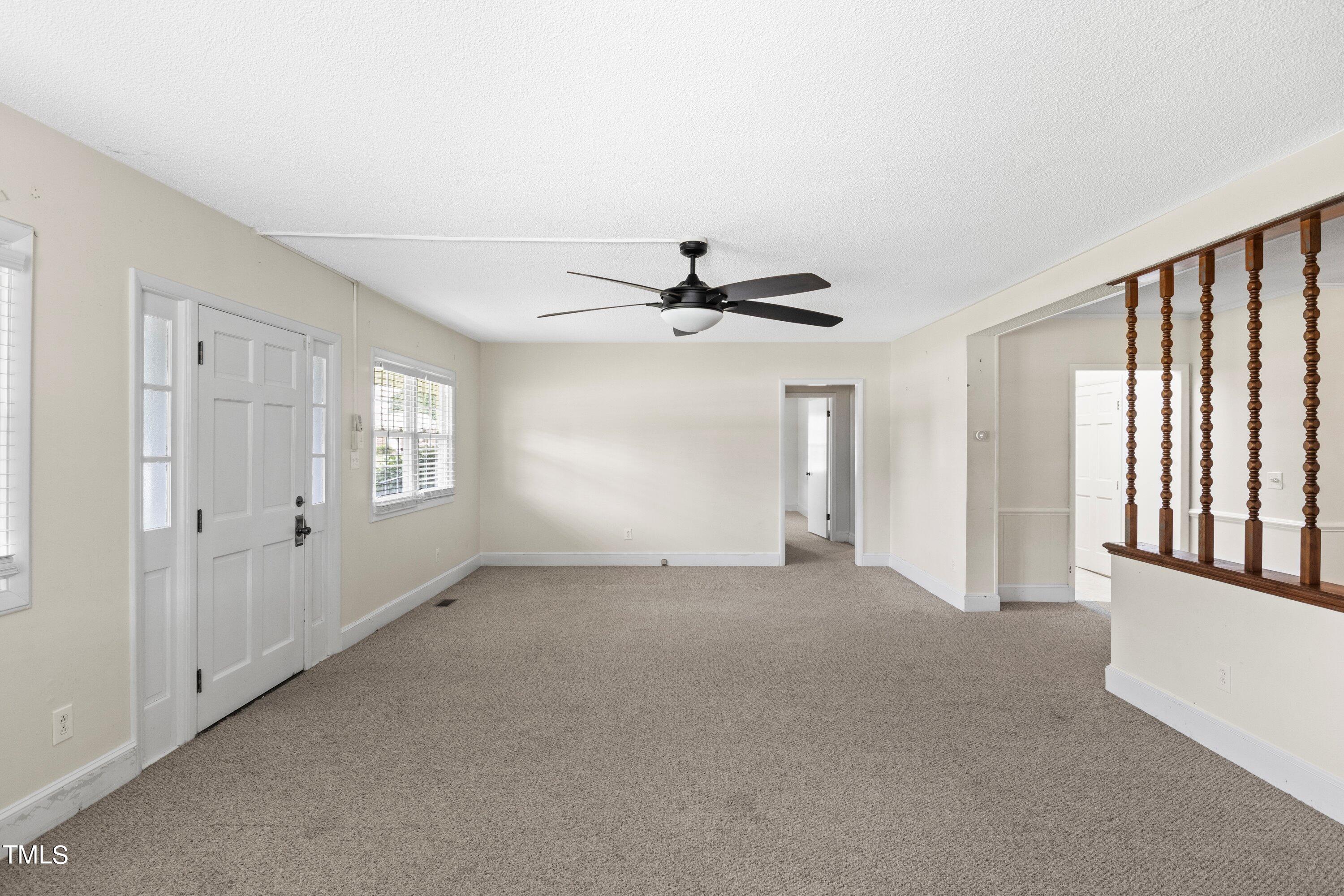 11 Partin Road Dunn, NC 28334 - Photo 10 of 46 a view of a livingroom with a ceiling fan and window