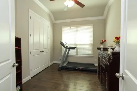 a room that has a bed and a chandelier