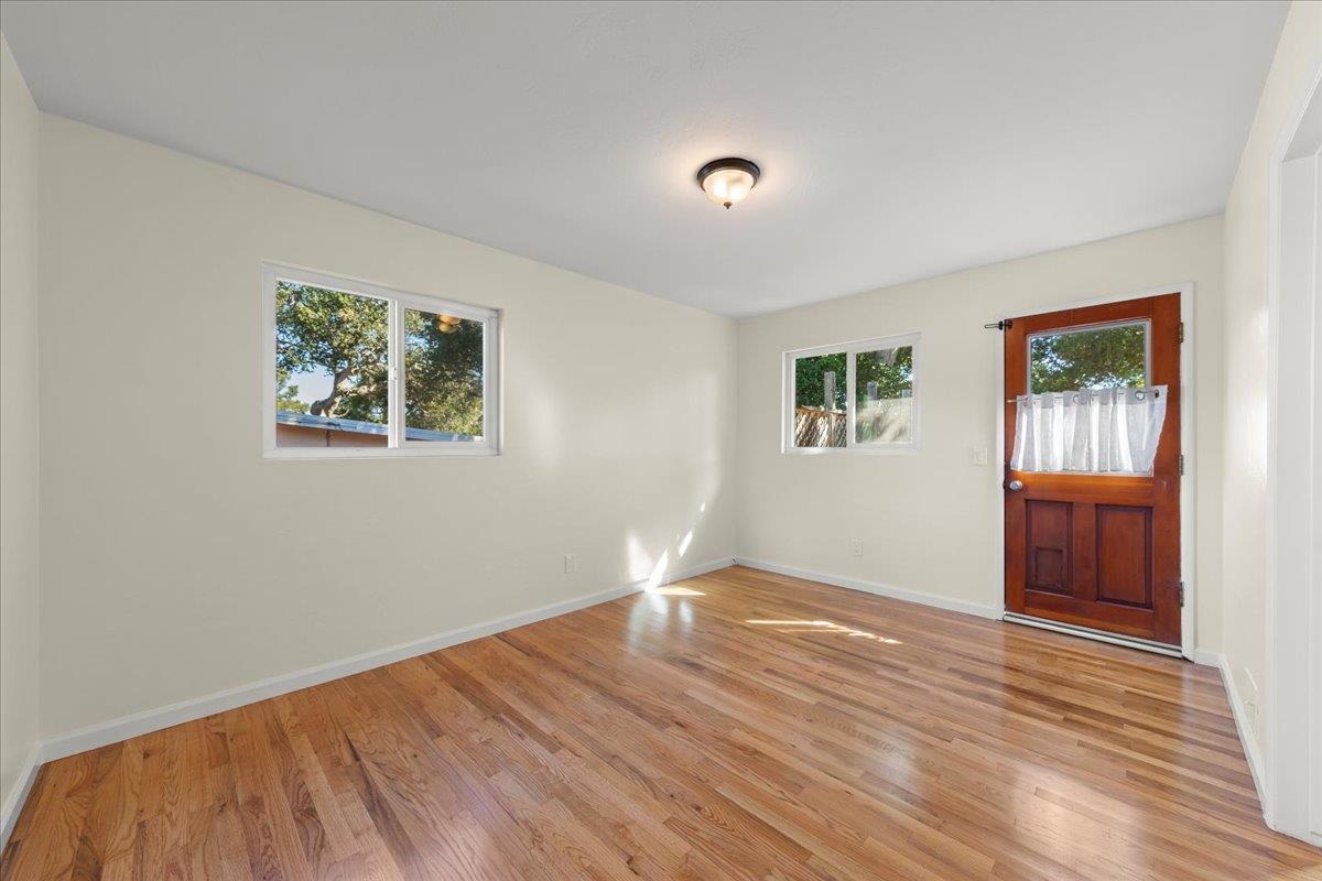 41 Ralston Drive Monterey, CA 93940 - Photo 15 of 31 a view of an empty room with wooden floor and a window