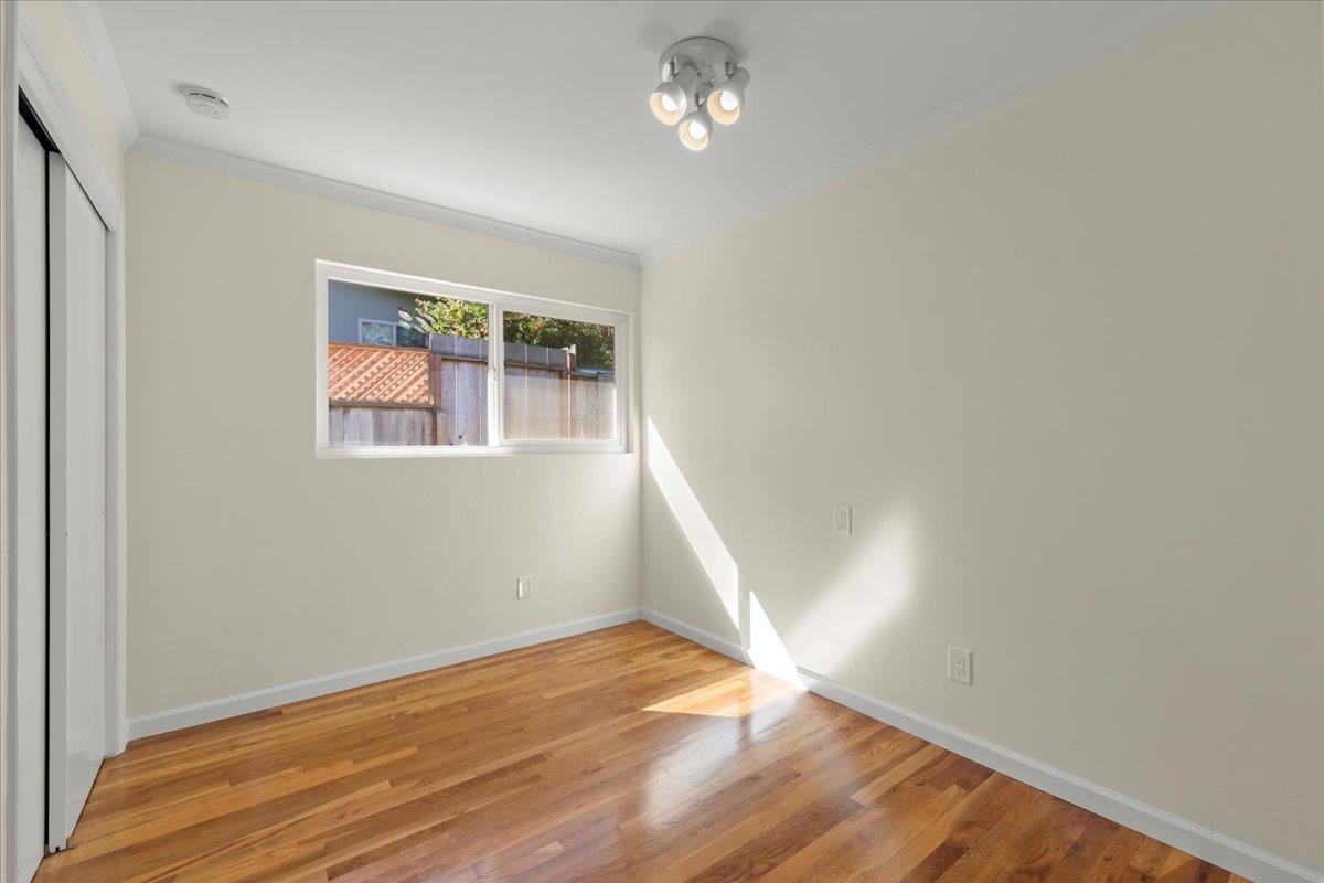 41 Ralston Drive Monterey, CA 93940 - Photo 21 of 31 wooden floor in an empty room with a window
