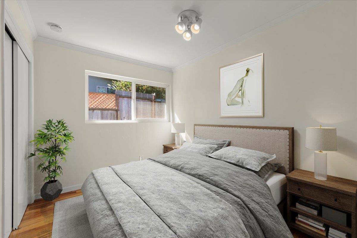 41 Ralston Drive Monterey, CA 93940 - Photo 23 of 31 a bedroom with a bed and a potted plant