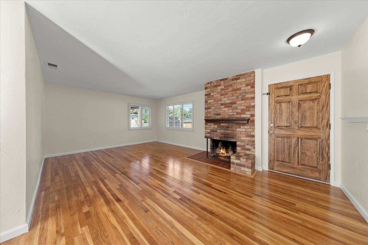 41 Ralston Drive Monterey, CA 93940 - Photo 7 of 31 a view of empty room with fireplace and wooden floor