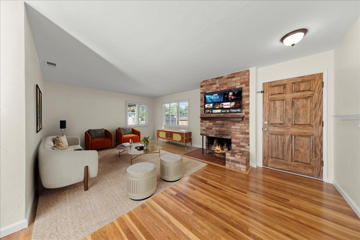 41 Ralston Drive Monterey, CA 93940 - Photo 8 of 31 a living room with furniture and a fireplace