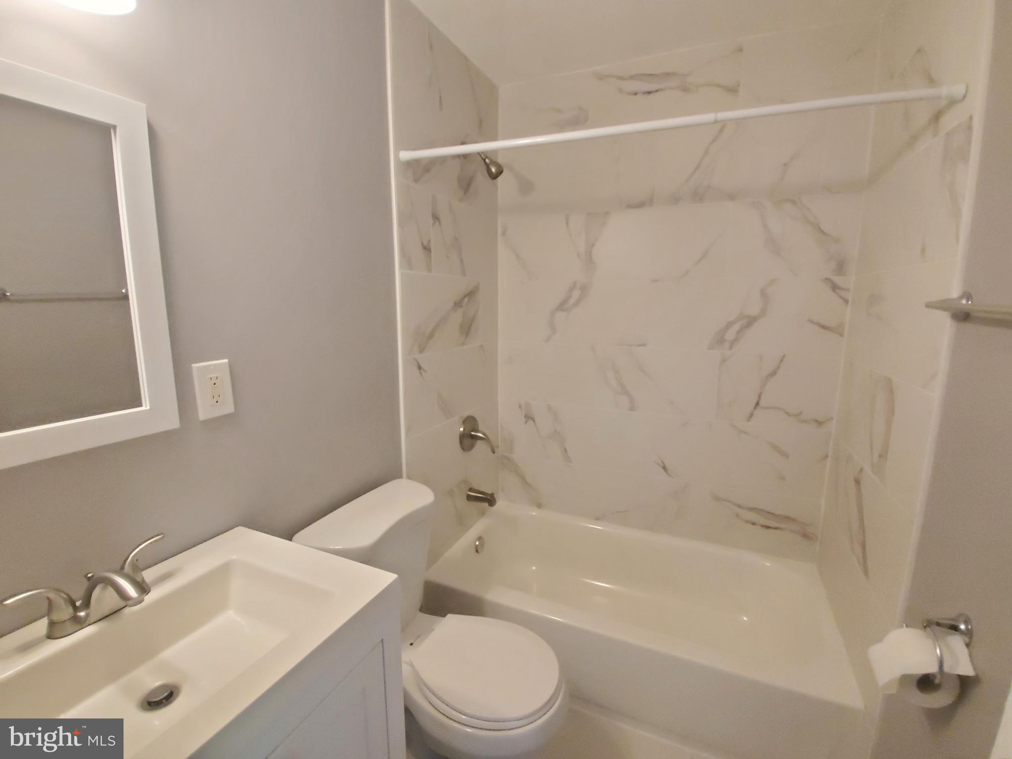 19349 Keymar Way Montgomery Village, MD 20886 - Photo 6 of 13 a bathroom with a sink toilet and shower