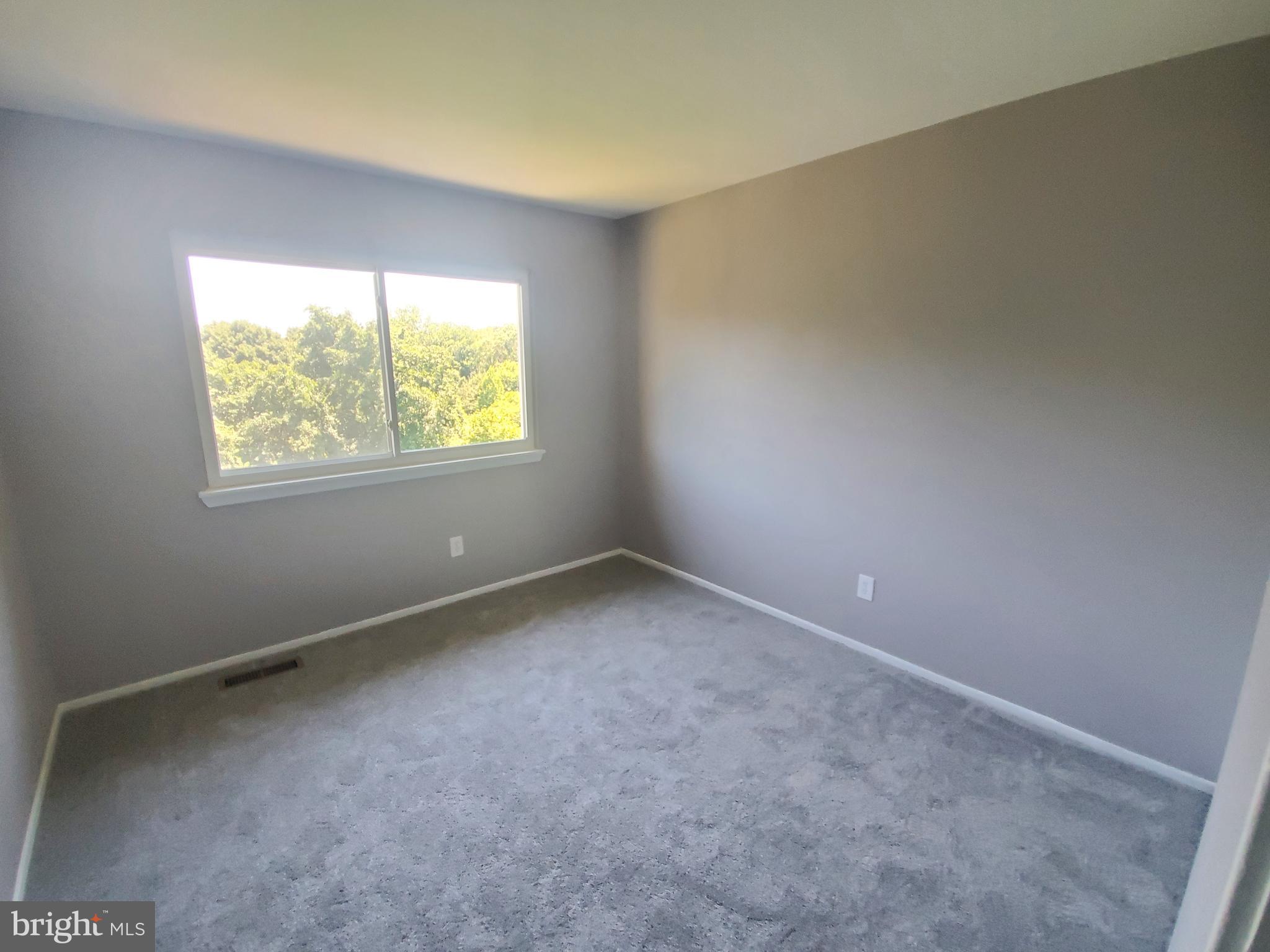 19349 Keymar Way Montgomery Village, MD 20886 - Photo 8 of 13 an empty room with windows