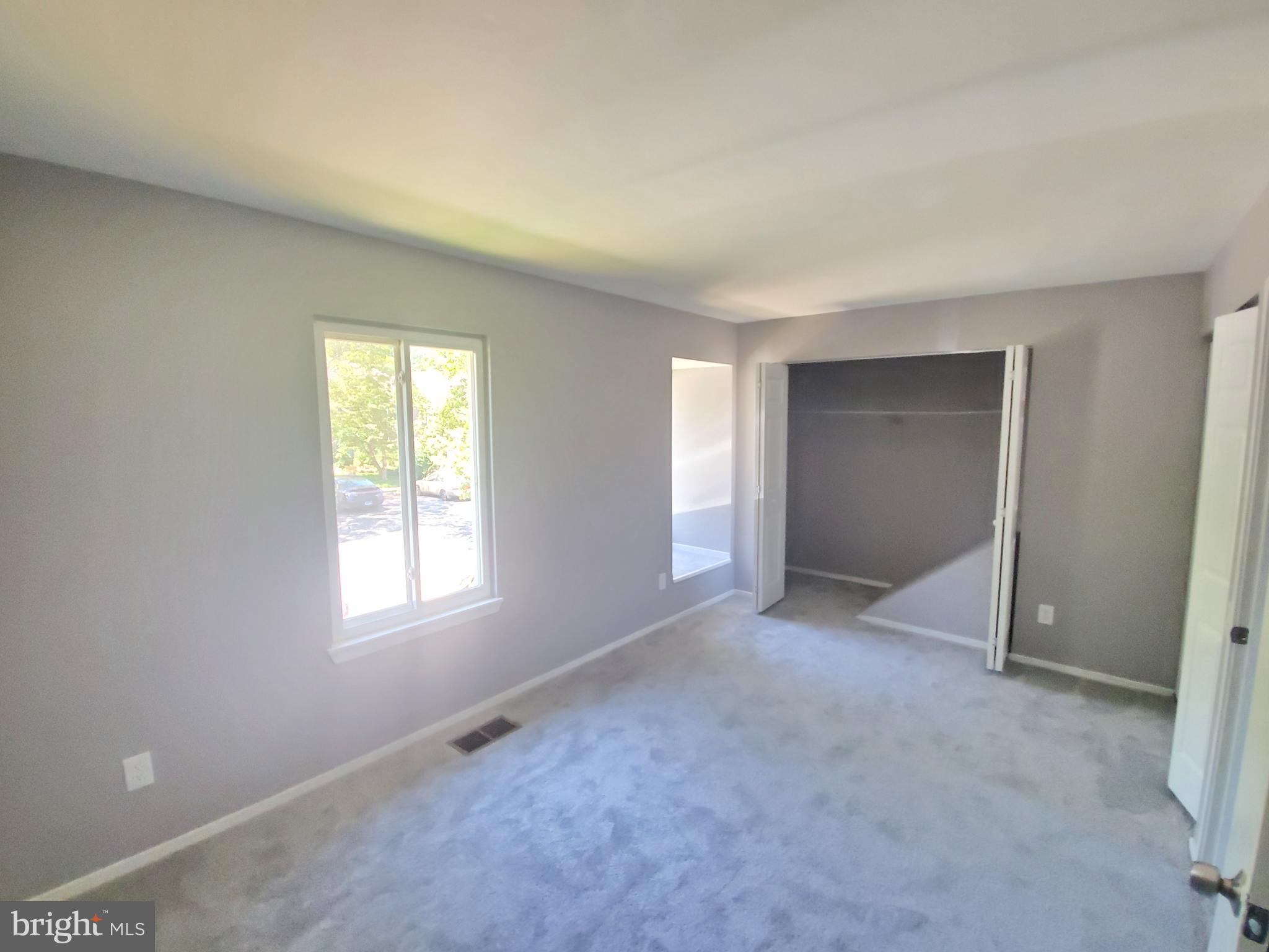 19349 Keymar Way Montgomery Village, MD 20886 - Photo 9 of 13 an empty room with windows and closet