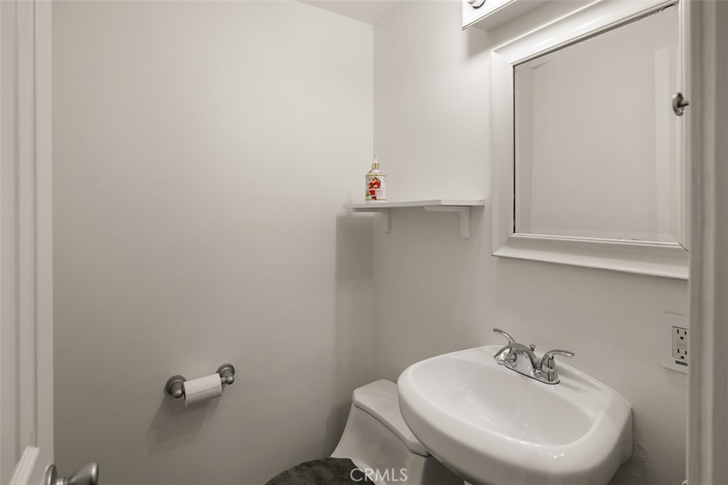 1391 North Fenimore Avenue Covina, CA 91722 - Photo 17 of 43 a bathroom with a sink and a mirror