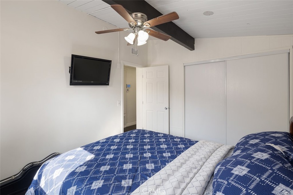 1391 North Fenimore Avenue Covina, CA 91722 - Photo 27 of 43 a bedroom with a bed and a flat screen tv