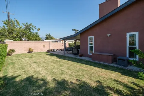 a view of swimming pool of house with outdoor seating