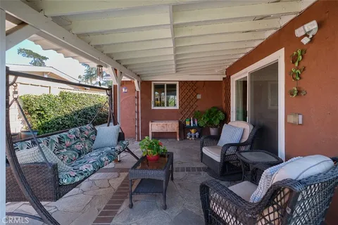 a outdoor living space with furniture and garden view