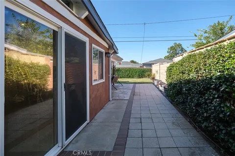 a view of a pathway both side of house