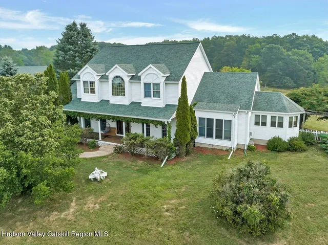 front view of a house with a bench
