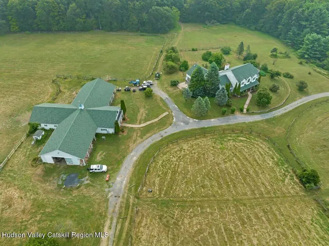 a view of a chairs and table in a patio