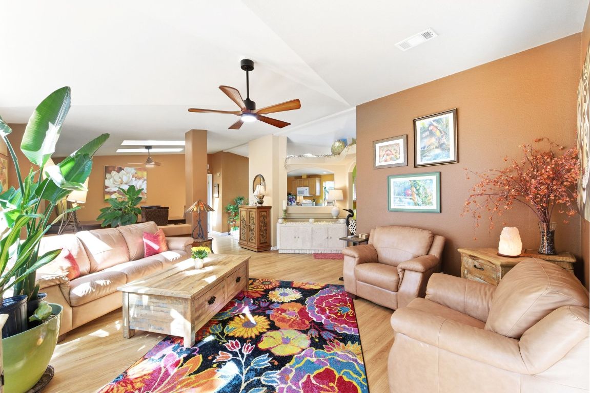 120 Cedar Bend Road Wimberley, TX 78676 - Photo 12 of 40 a living room with furniture and a chandelier
