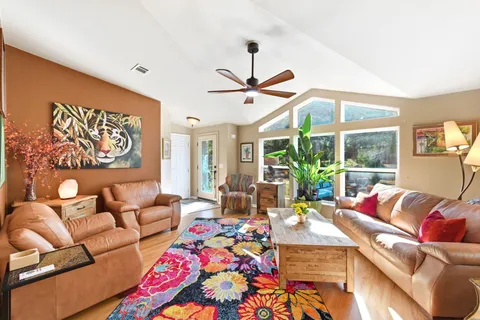 a view of a living room and dining room