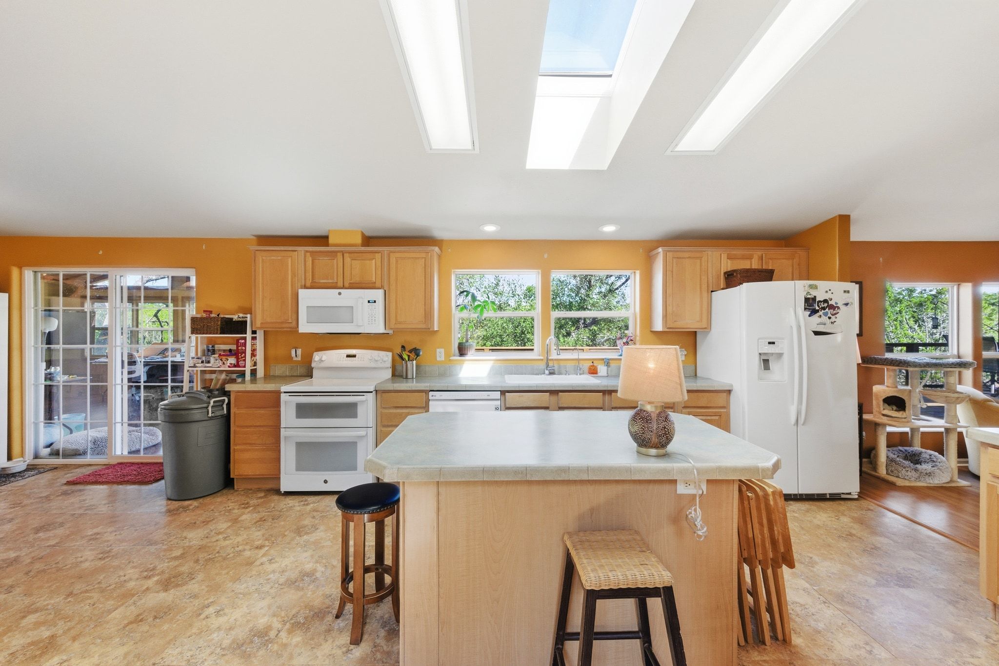 120 Cedar Bend Road Wimberley, TX 78676 - Photo 14 of 40 a dining room with furniture a large window and a kitchen view