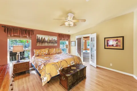 a bedroom with a bed and a desk
