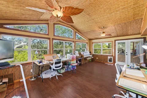 a view of a balcony with wooden floor