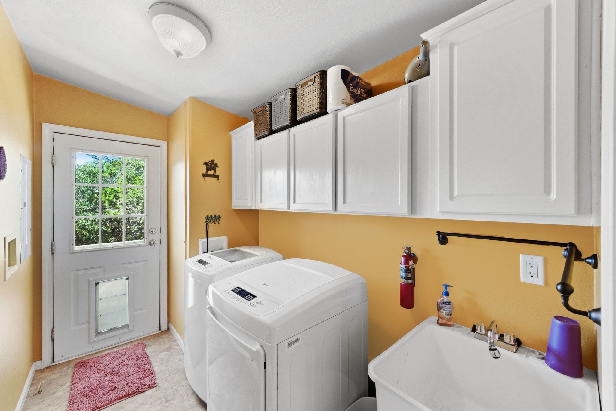 120 Cedar Bend Road Wimberley, TX 78676 - Photo 25 of 40 a bathroom with a sink and a washer dryer