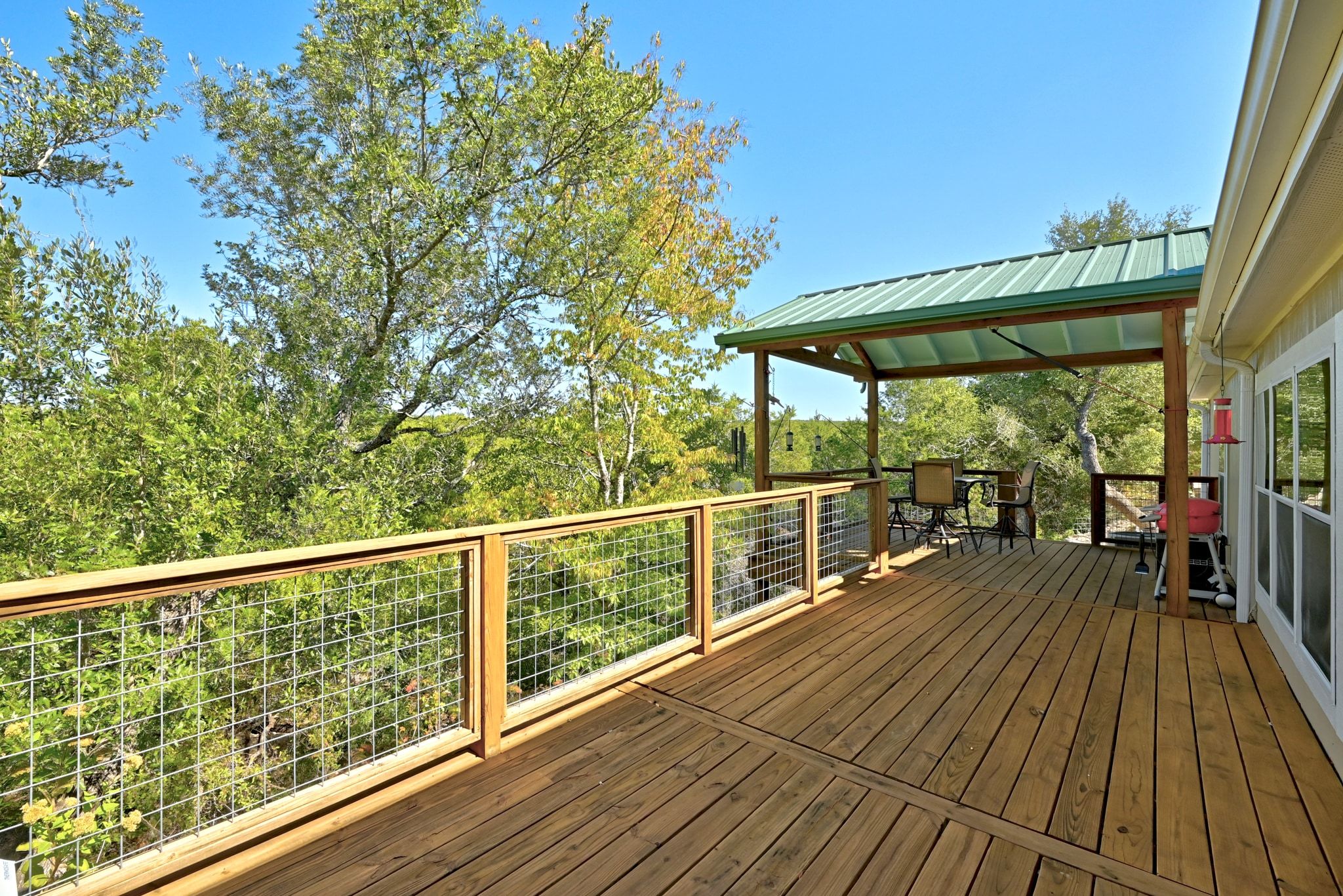 120 Cedar Bend Road Wimberley, TX 78676 - Photo 26 of 40 a view of a balcony with wooden floor