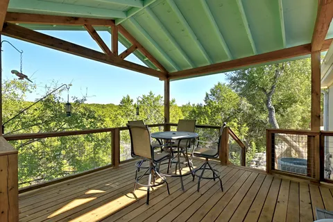 a backyard of a house with large trees and outdoor space