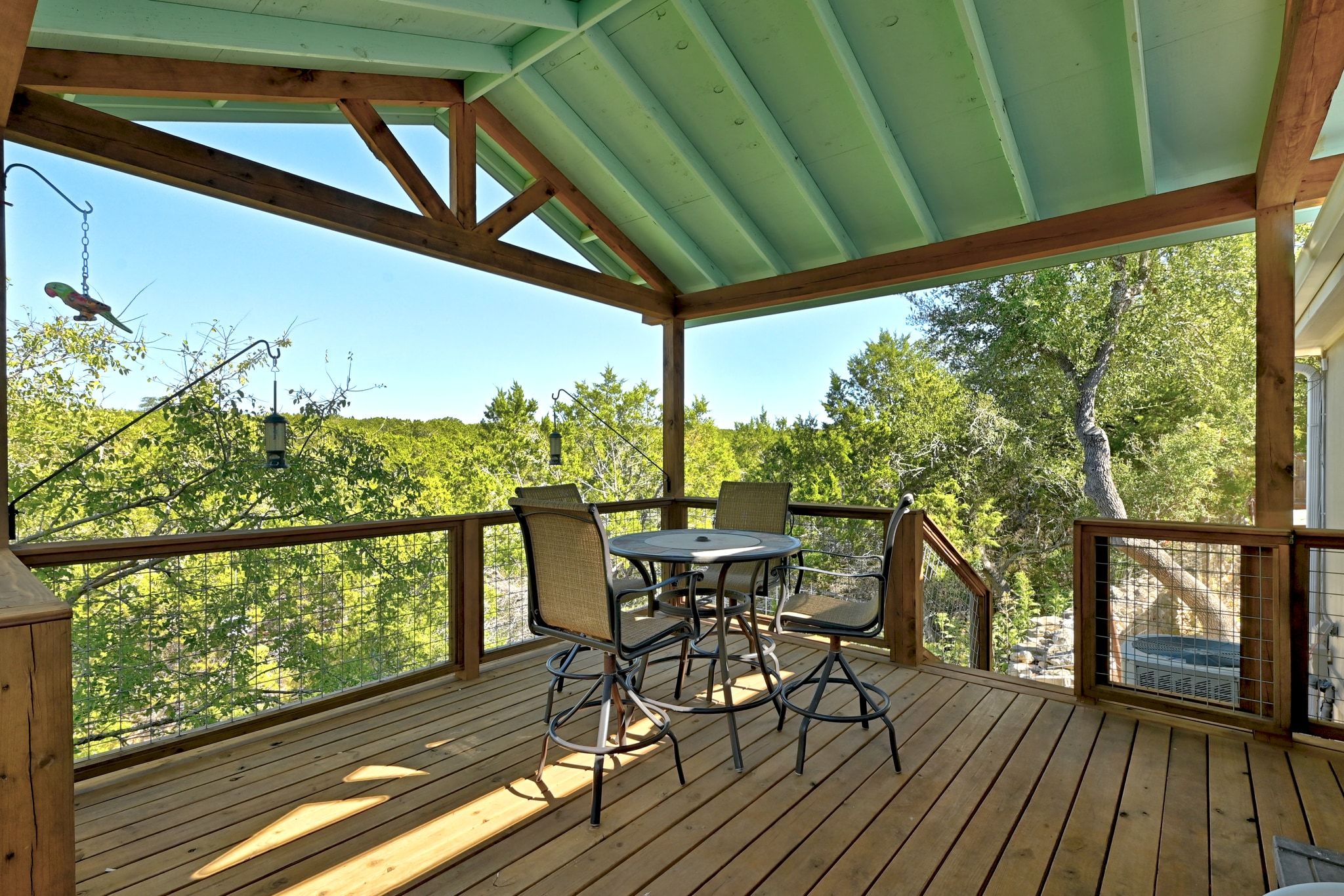 120 Cedar Bend Road Wimberley, TX 78676 - Photo 27 of 40 a view of a chairs and table in the balcony