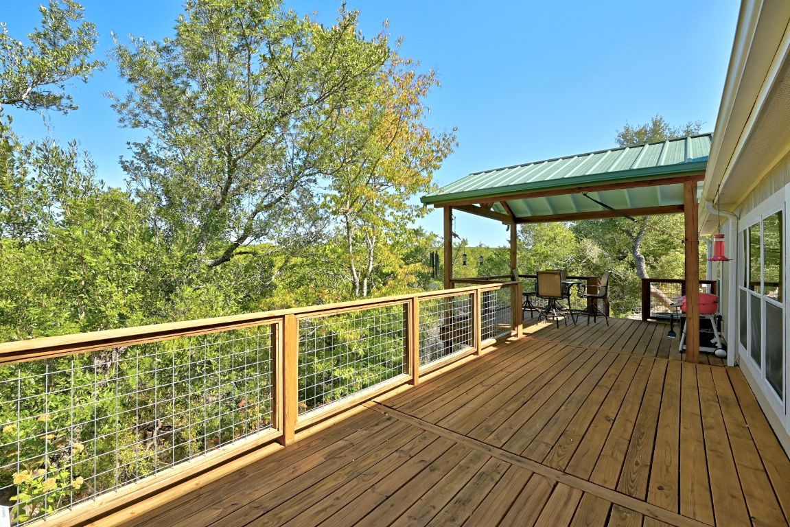 120 Cedar Bend Road Wimberley, TX 78676 - Photo 28 of 40 a view of a balcony with wooden floor