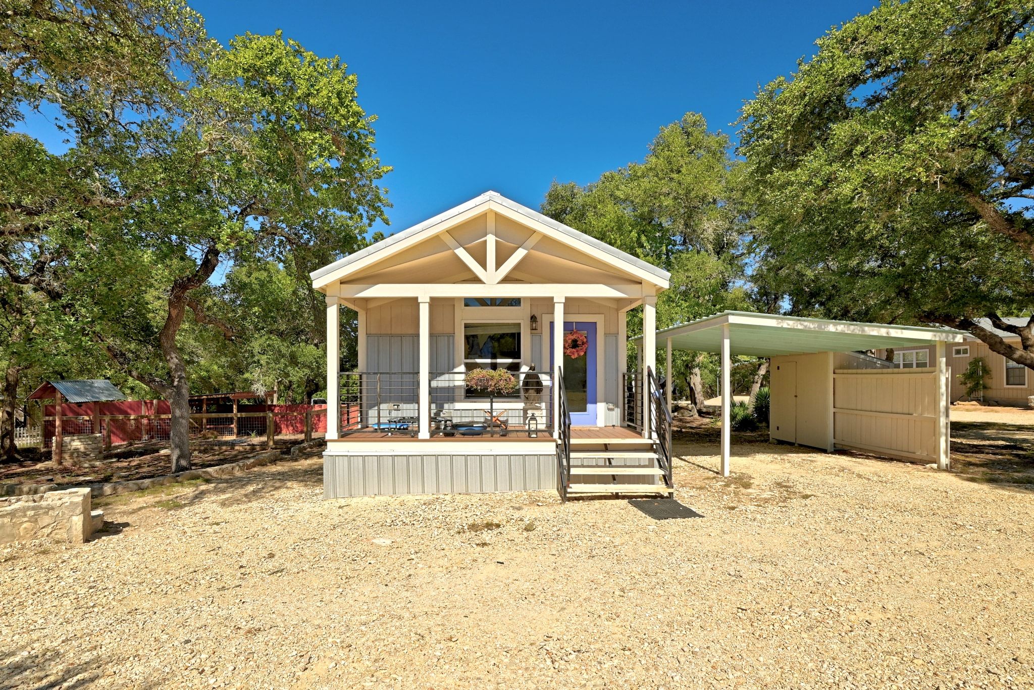 120 Cedar Bend Road Wimberley, TX 78676 - Photo 32 of 40 a view of a house with backyard porch and sitting area