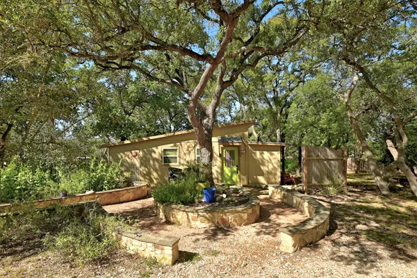 a view of a barn in the middle of a yard