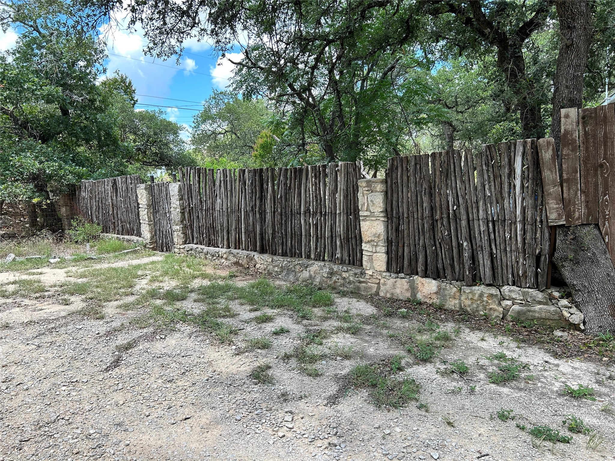 120 Cedar Bend Road Wimberley, TX 78676 - Photo 35 of 40 a view of small yard with wooden fence