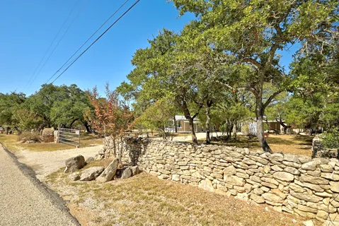 a view of a small yard in front of a house