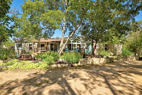 a view of a patio with wooden floor