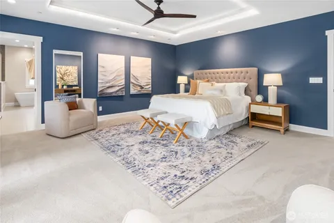 a bedroom with a bed couch and window