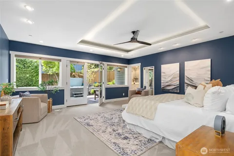 a large bedroom with a large bed and a large window