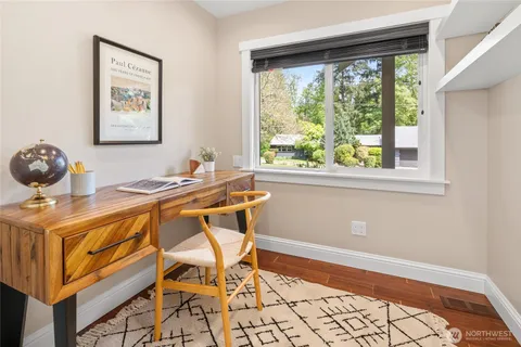 a workspace with furniture and window