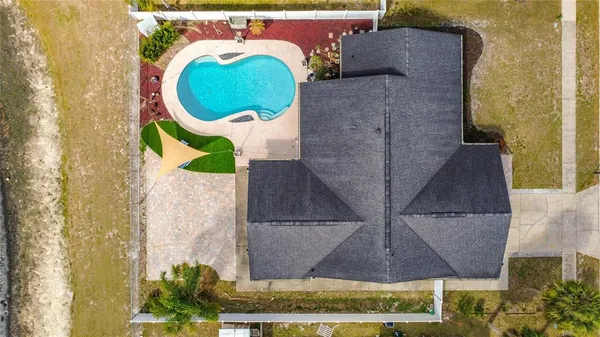 a view of a swimming pool with a patio
